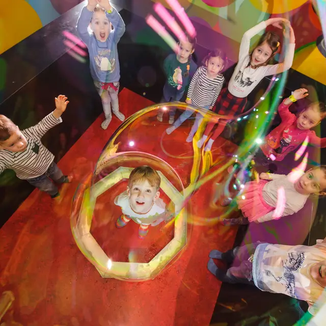Overhead view of a child inside a bubble ring