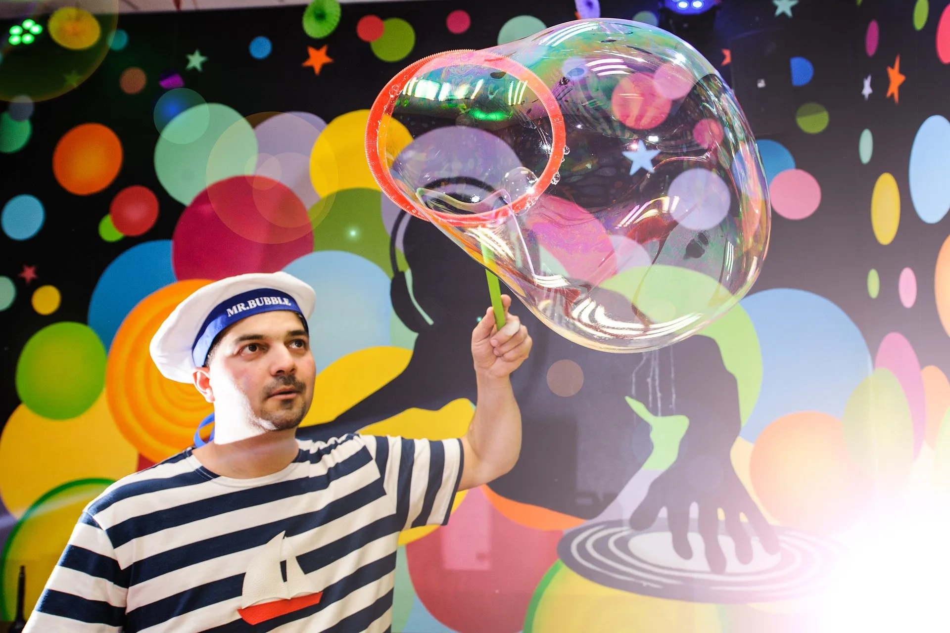 Mr. Bubble blowing a giant bubble during a show